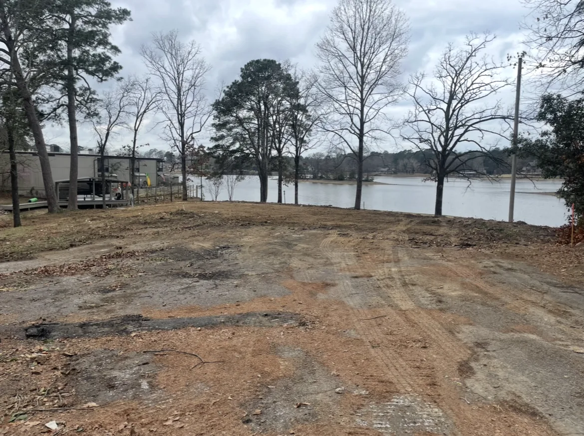 Lakefront lot cleared and graded to clean dirt